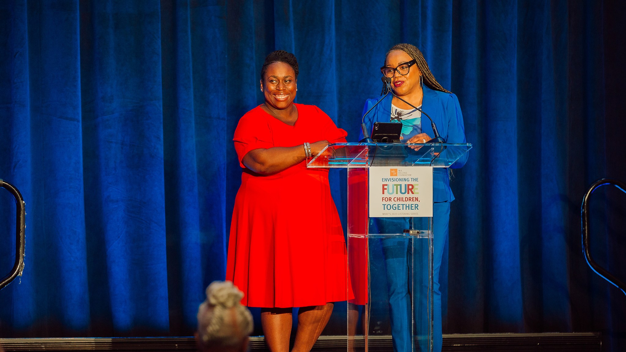 Carla Thompson Payton and Alandra Washington speaking on stage